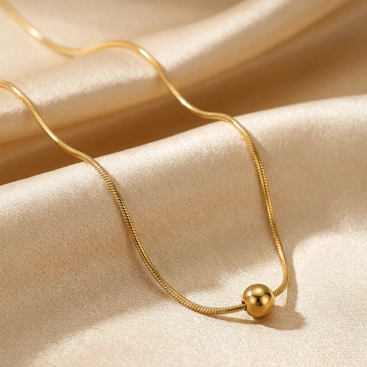 Customized Necklace by Urban Heaven in White / Gold color, shown in a studio setting