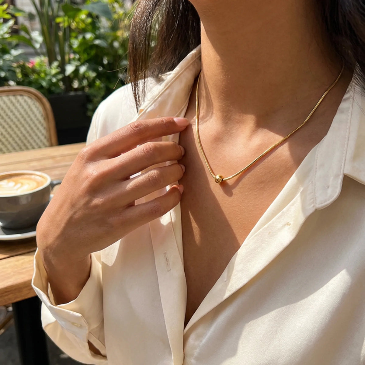 customized necklace in Gold / Gold color, shown in a lifestyle setting